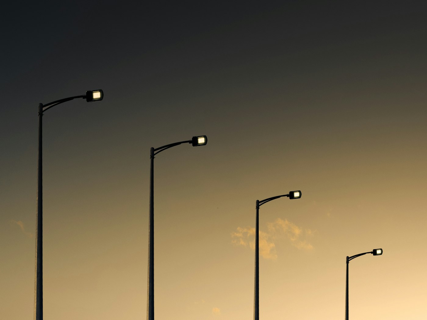 Street light poles illuminated at night